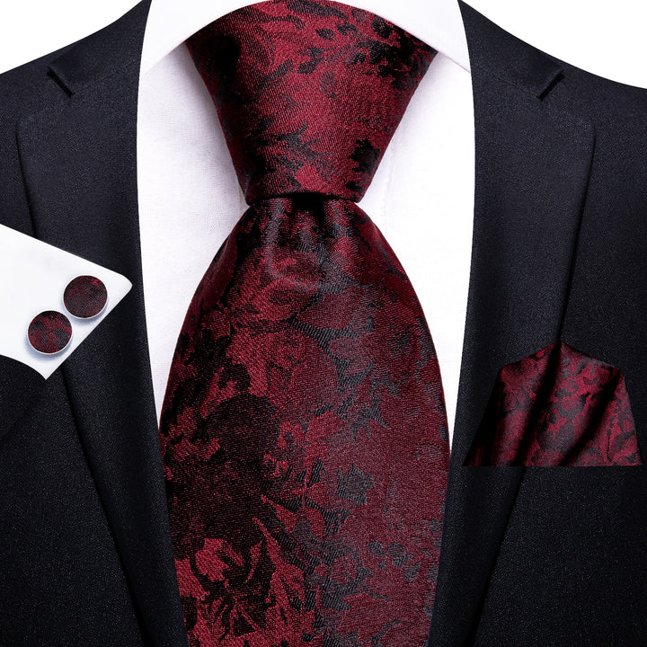 black suit and burgundy tie
