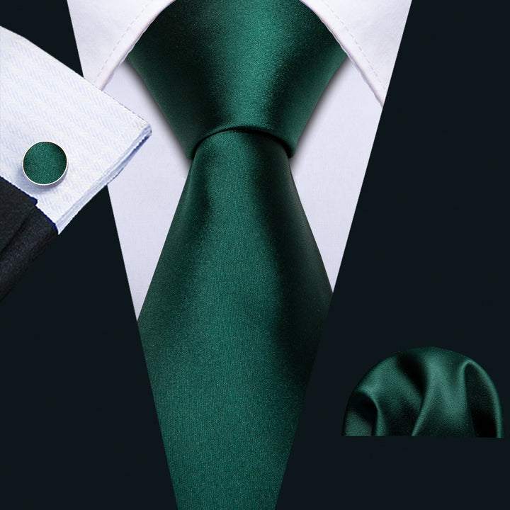 black suit with green tie